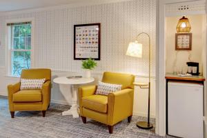 a waiting room with two chairs and a table at Basin Harbor in Vergennes