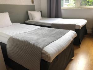Postel nebo postele na pokoji v ubytování Viktoria Hotell & Konferens