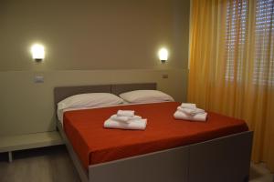 Postel nebo postele na pokoji v ubytování Orchidea Marina