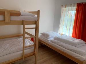 Postel nebo postele na pokoji v ubytování Apartmány Michaela