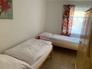 Postel nebo postele na pokoji v ubytování Apartmány Michaela