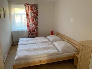 Postel nebo postele na pokoji v ubytování Apartmány Michaela