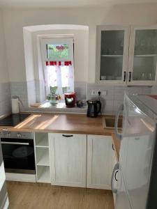 Kuchyň nebo kuchyňský kout v ubytování Apartmány Michaela
