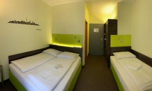 Voodi või voodid majutusasutuse Behringers City Hotel Nürnberg toas