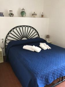 Letto o letti in una camera di Villino Fraginesi