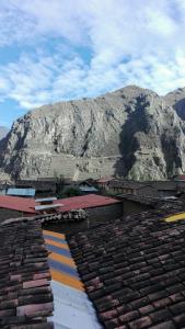 a view of a mountain from the roof of a building at B&B Chayana Wasi in Ollantaytambo