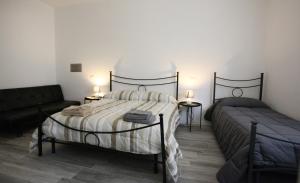 Postel nebo postele na pokoji v ubytování B&B Natù