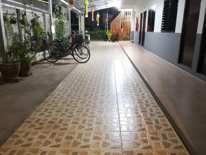 a hallway with bikes parked in a building at Ban Maitree in Chiang Mai