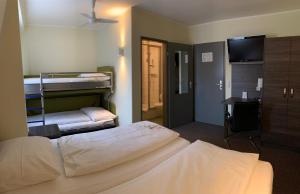 Voodi või voodid majutusasutuse Behringers City Hotel Nürnberg toas