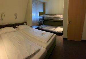 Voodi või voodid majutusasutuse Behringers City Hotel Nürnberg toas