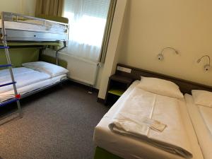 Voodi või voodid majutusasutuse Behringers City Hotel Nürnberg toas