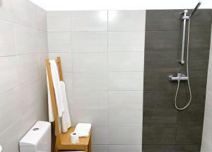 a bathroom with a shower and a toilet at Columbia Praia Da Rocha Apartamento in Portimão