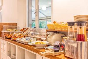 a kitchen counter with a lot of food on it at Guerrini Hotel in Castiglioncello