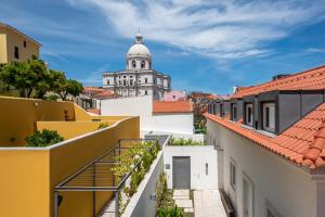 a view of the cathedral from the roofs of buildings at Tandem Palacio Alfama Suites in Lisbon