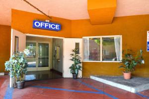 an office building with a sign that reads office at H3 Inn & Suites - LAX Airport - Los Angeles in Inglewood