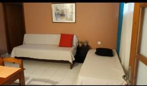 A bed or beds in a room at Alexandra Hotel