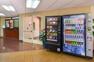 a vending machine in a hallway with soda and sodas at H3 Inn & Suites - LAX Airport - Los Angeles in Inglewood