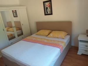 מיטה או מיטות בחדר ב-Apartman Simona