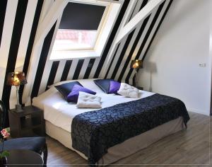 Postel nebo postele na pokoji v ubytování Hotel Zeezicht