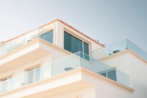 a glass balcony on a house at ARXONTIKO in Himare