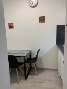 Televízia a/alebo spoločenská miestnosť v ubytovaní ORIGO