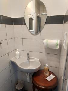 a bathroom with a sink and a mirror at U Marka in Dąbrowy