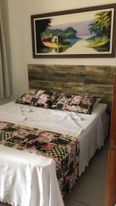 Cama o camas de una habitación en Pousada Aconchego