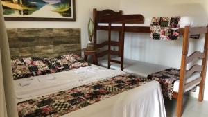 Cama o camas de una habitación en Pousada Aconchego