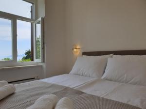 Postel nebo postele na pokoji v ubytování Apartment Alex - Sea View