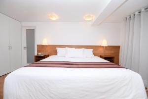 Postel nebo postele na pokoji v ubytování Hotel Plaza de Armas Cusco