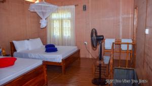 Letto o letti in una camera di Sigiriya Free View Tree House & Villa