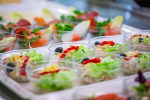 a buffet line of salad dishes in plastic cups at Grupotel Club Menorca in Son Xoriguer