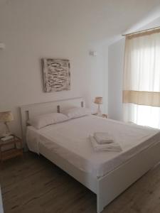 Postel nebo postele na pokoji v ubytování Domo Green House