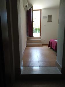 Postel nebo postele na pokoji v ubytování B&B Da Fiorò