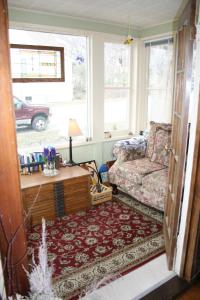 a living room with a couch and a coffee table at Serendipity Bed and Breakfast in Saugatuck