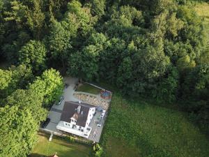 an aerial view of a house in the middle of a forest at Pokoje Na Szlaku in Lądek-Zdrój