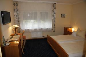 Postel nebo postele na pokoji v ubytování Hotel Anika