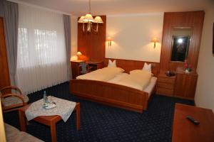 Postel nebo postele na pokoji v ubytování Hotel Anika