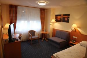 Postel nebo postele na pokoji v ubytování Hotel Anika