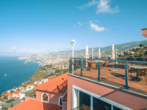 a balcony of a building with a view of the ocean at Ocean Gardens in Funchal