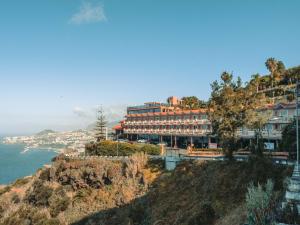 a hotel on a hill next to the ocean at Ocean Gardens in Funchal