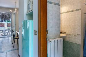 Kuchyň nebo kuchyňský kout v ubytování Oleandri Suite Hotel