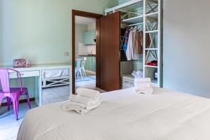 Postel nebo postele na pokoji v ubytování Oleandri Suite Hotel