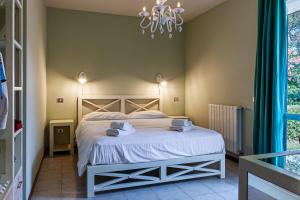 Postel nebo postele na pokoji v ubytování Oleandri Suite Hotel