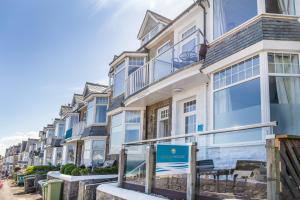 a building with a sign in front of it at Ocean House in St Ives