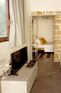 A bed or beds in a room at Studio Panagiota - Oasis holiday houses