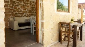 A seating area at Studio Panagiota - Oasis holiday houses