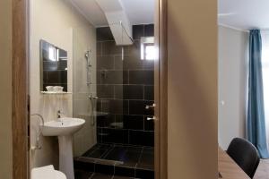 Koupelna v ubytování Hotel Bordeaux