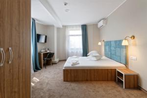 Postel nebo postele na pokoji v ubytování Hotel Bordeaux