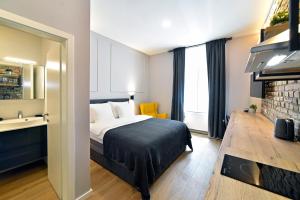 a hotel room with a bed and a sink at Imperial Apartment, Zagreb City Center West in Zagreb